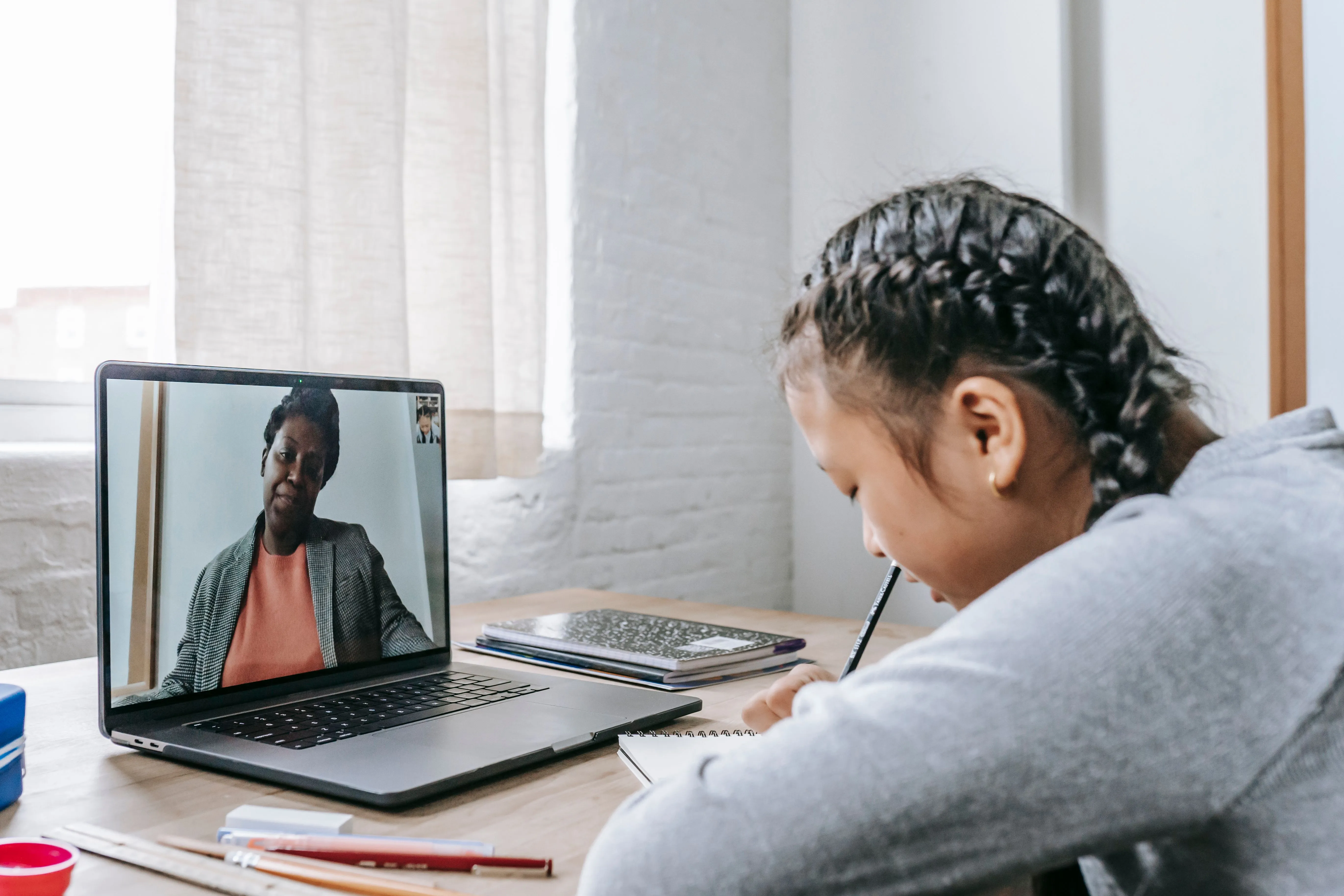 Woman on laptop in a calm setting — virtual ADHD consultation